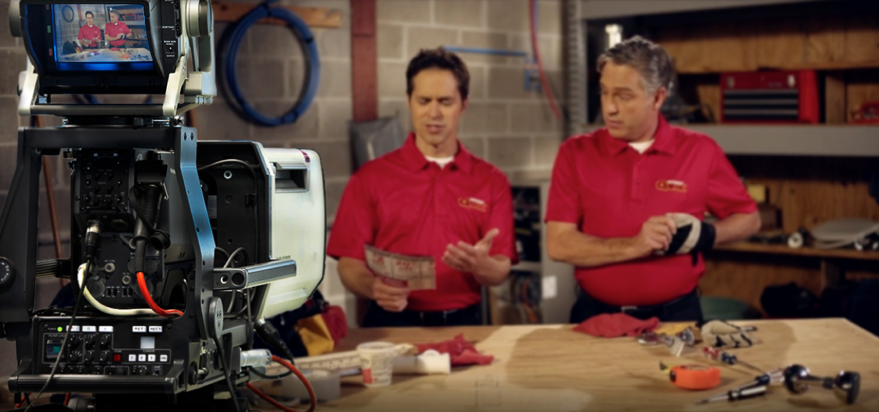 Banner with two men filming a video project